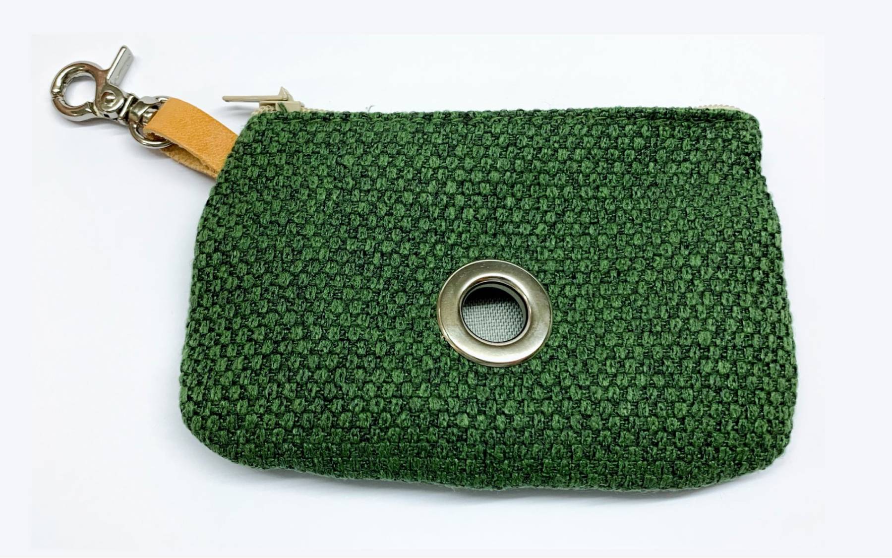 A product shot of the green poo bag holder